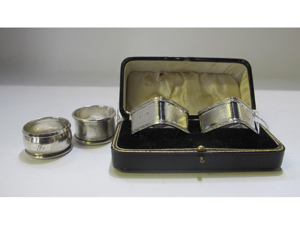 Appraisal: A lot comprising a cased pair of silver napkin rings