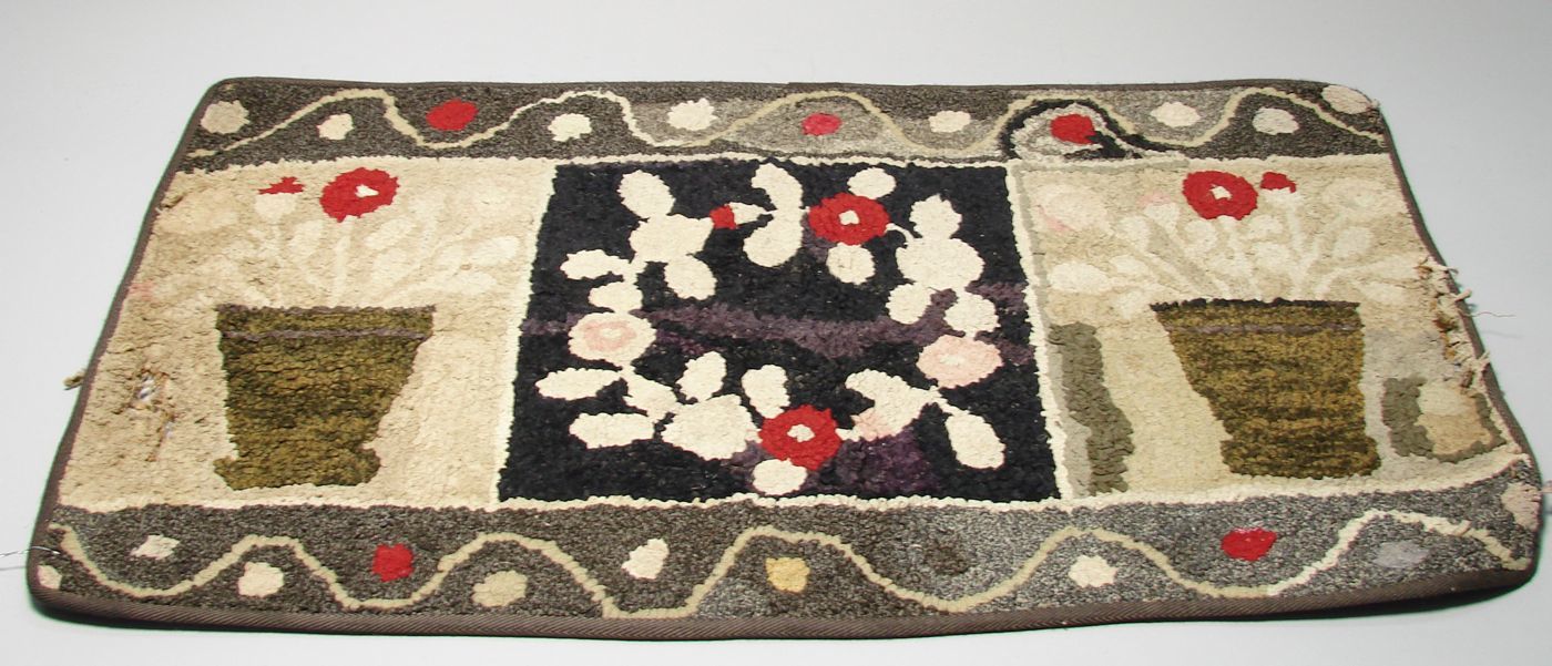 Appraisal: HOOKED RUG ' x ' Central panel depicts a wreath-form