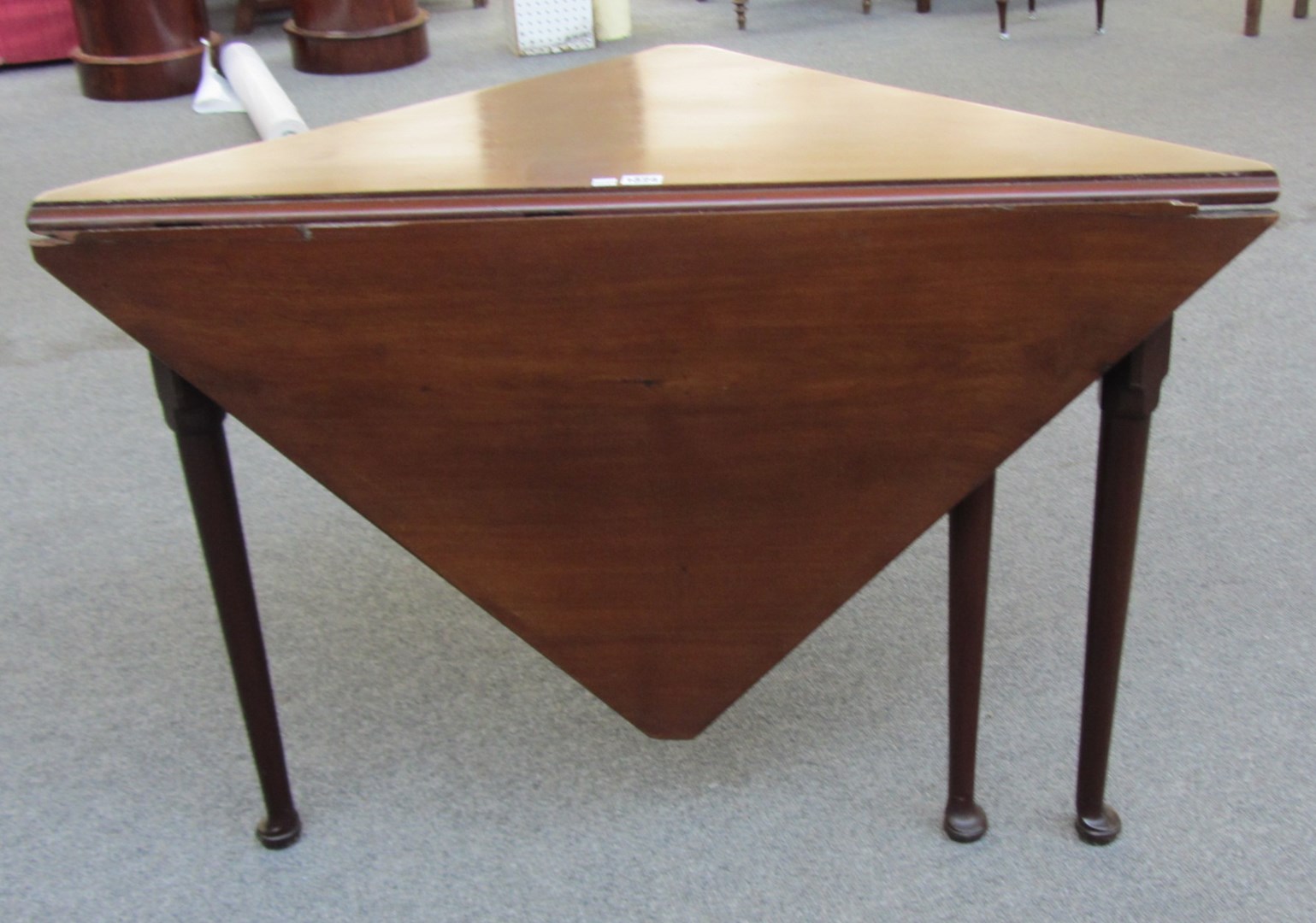 Appraisal: A mid th century handkerchief drop flap table on pad