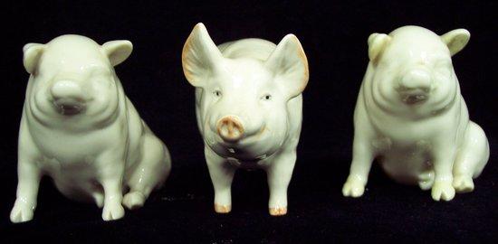 Appraisal: Two Belleek seated pigs cm high and a Beswick boar