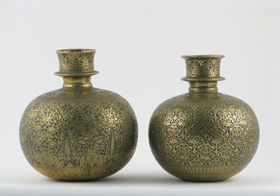 Appraisal: Two Indian brass hookah bases each engraved with stylized flowers