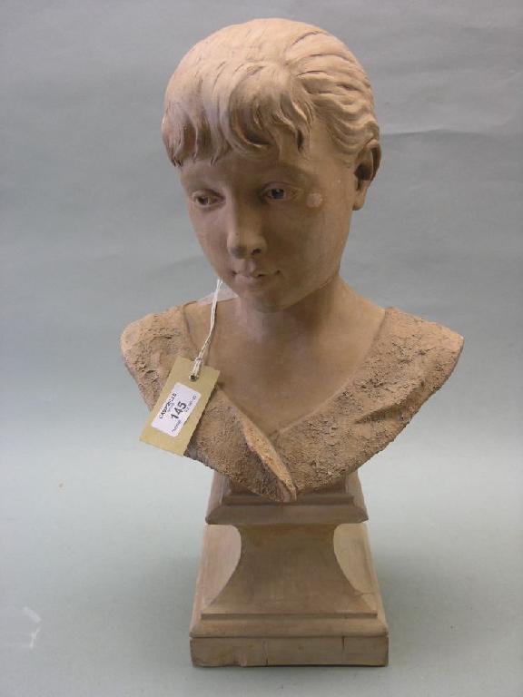 Appraisal: A sculpted terracotta portrait bust of a young boy signed