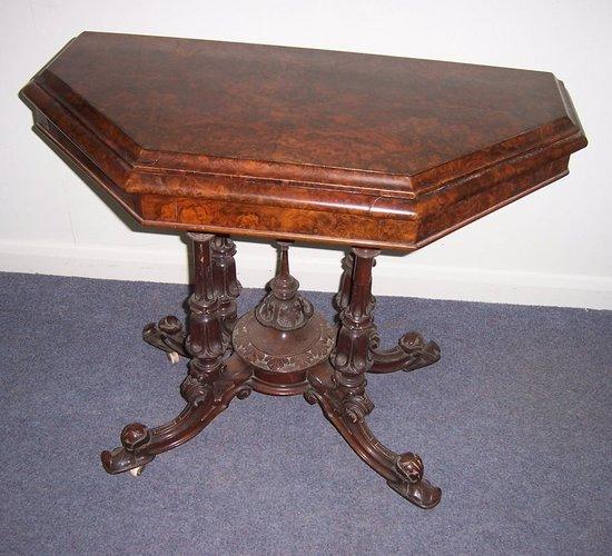 Appraisal: A Victorian burr walnut card table the canted fold-over top