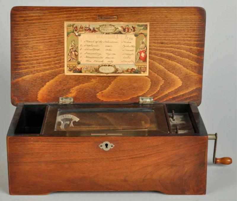 Appraisal: Oak Music Box Description Plays well Cylinder top with six