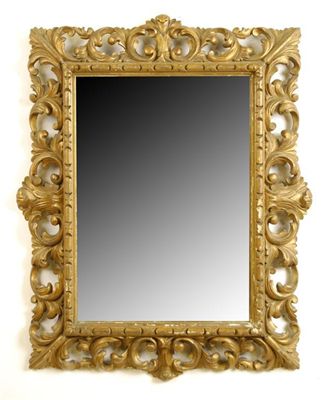 Appraisal: A carved giltwood and gesso rectangular wall mirror with a