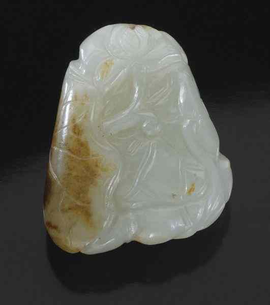 Appraisal: Chinese Qing carved pebble jade toggledepicting goldfish having russet skin