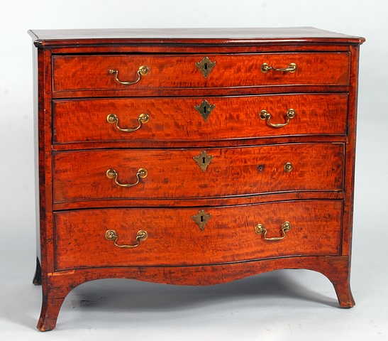 Appraisal: Four graduated serpentine-front drawers plum pudding fronts cock-beaded and with