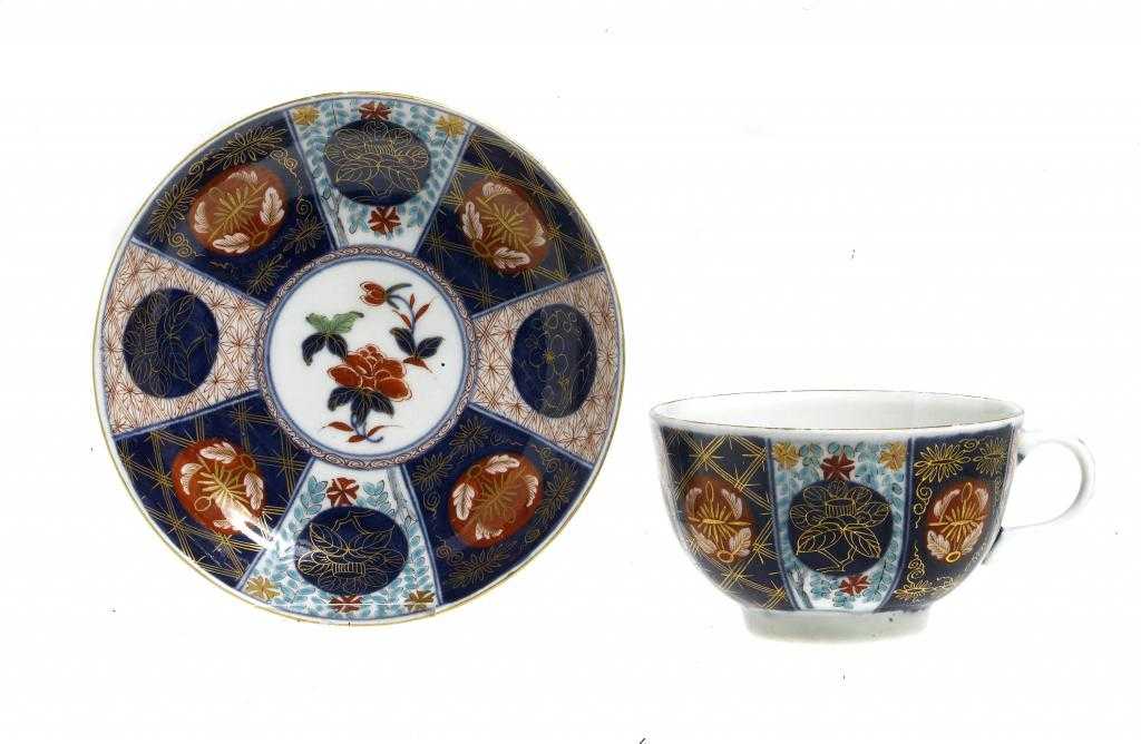 Appraisal: A WORCESTER IMARI TEACUP AND A SAUCER painted in brilliant