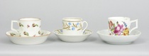 Appraisal: Group of Three Demi-Cups and Saucers circa th Century Lot