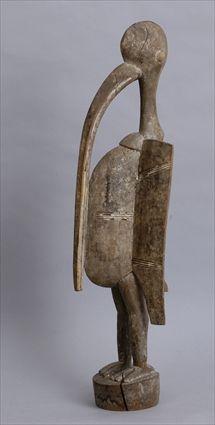 Appraisal: SENUFO CARVED WOOD FIGURE OF A BIRD Standing with distended