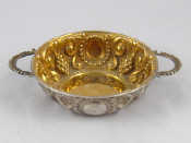 Appraisal: A Silver Portuguese wine taster brandy bowl with embossed grapes