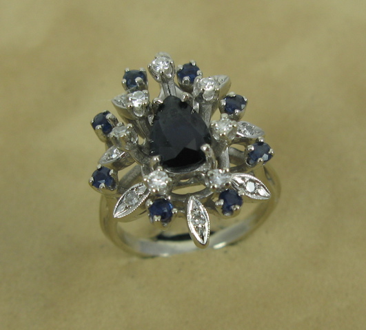 Appraisal: SAPPHIRE DIAMOND AND FOURTEEN KARAT GOLD RING centering a pear-cut