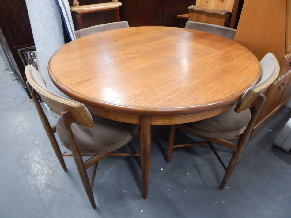 Appraisal: A 'G' plan teak circular extending dining table on turned