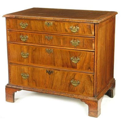 Appraisal: A walnut chest the crossbanded top with an applied moulded