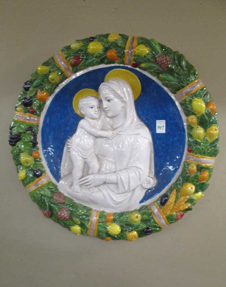 Appraisal: AN ITALIAN GLAZED TERRACOTTA ROUNDEL inspired by the works of