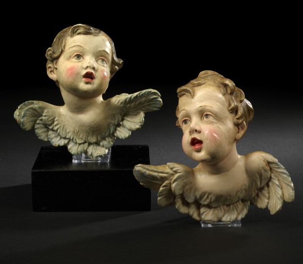 Appraisal: Pair of Austro-German Carved and Polychromed Wood Winged Putto Masques