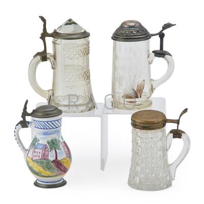 Appraisal: DECORATIVE STEINS Four with lids European th th c one