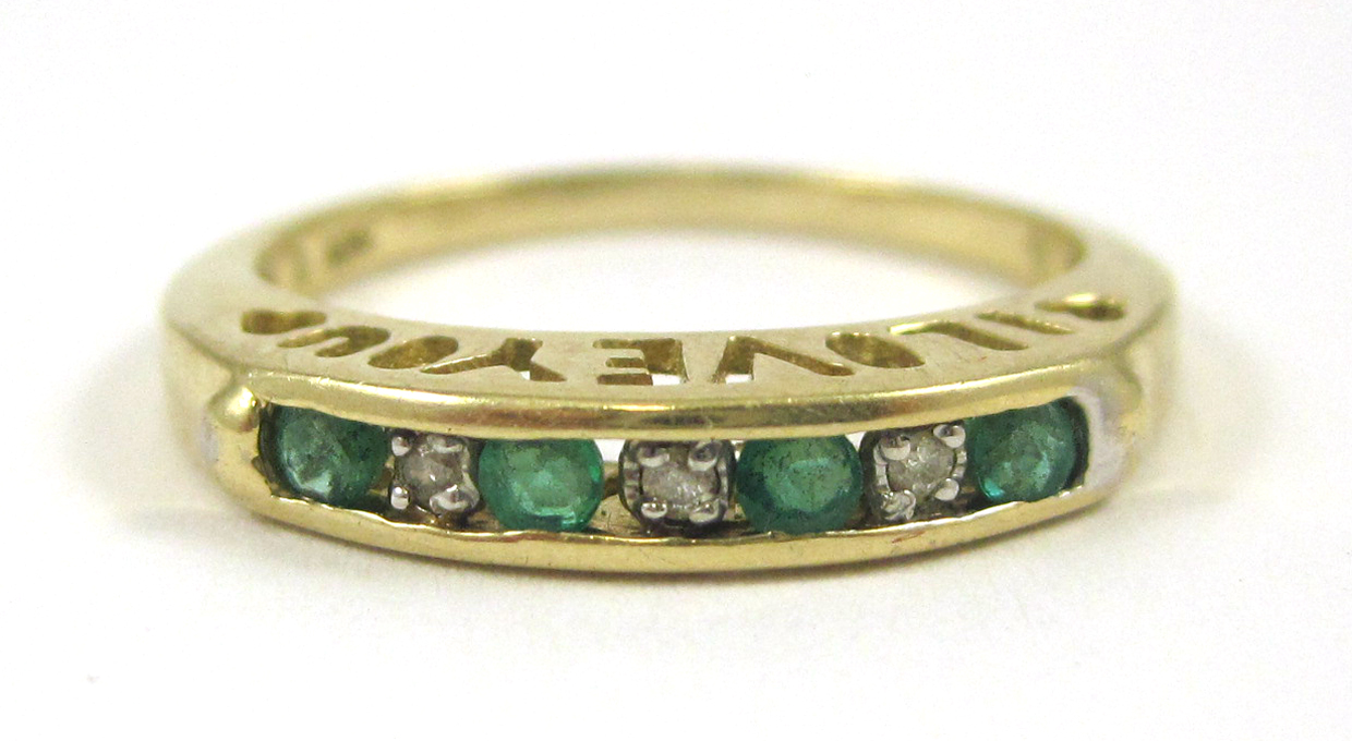 Appraisal: EMERALD DIAMOND AND TEN KARAT GOLD RING channel set with