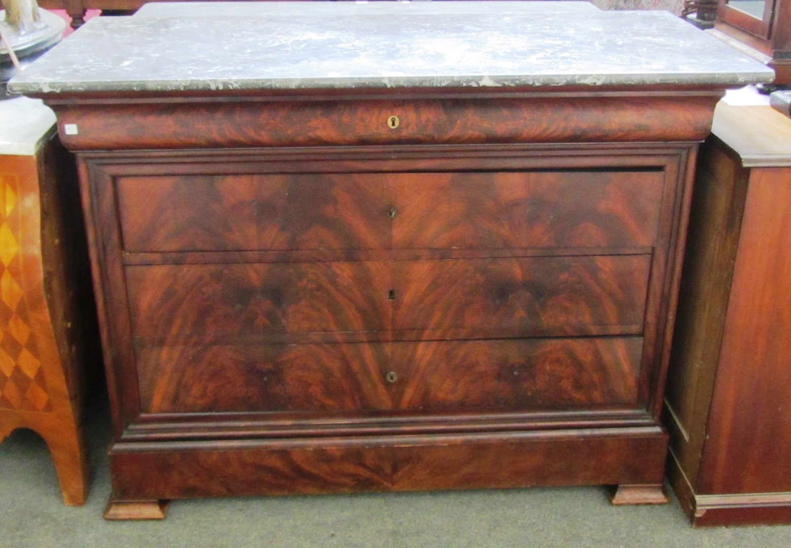 Appraisal: An early th century French marble top commode with five