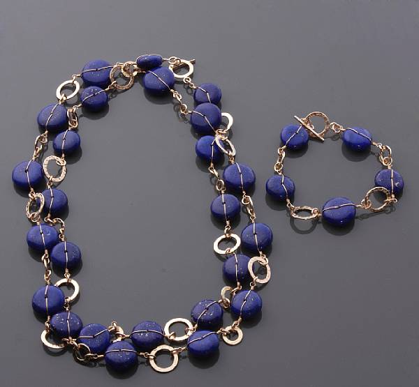 Appraisal: Lapis Lazuli Necklace and Bracelet Suite A rope-length necklace formed