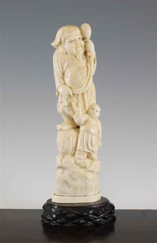 Appraisal: A large Japanese walrus ivory group of Daikoku and a