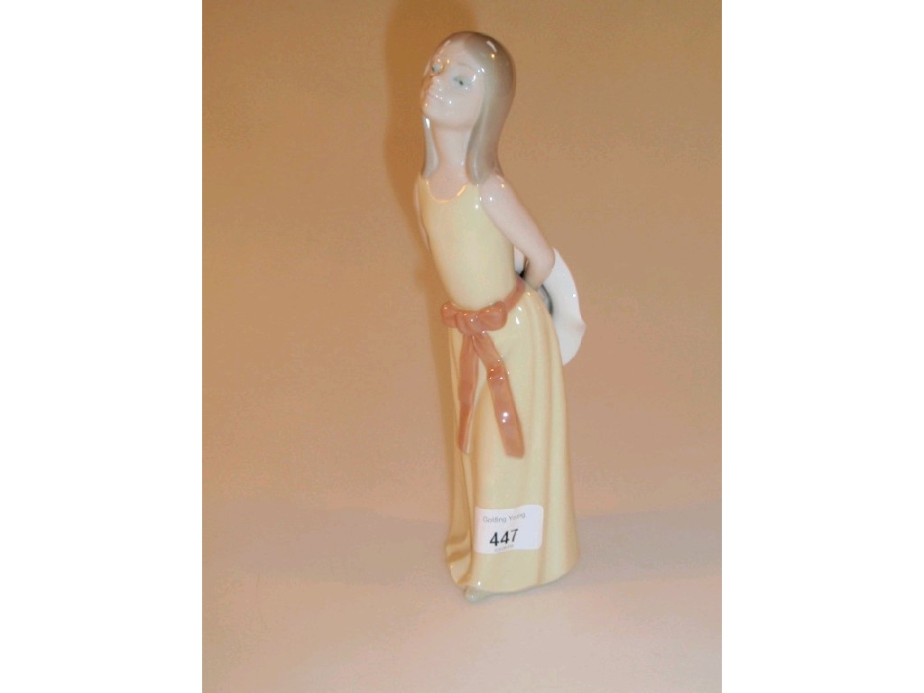 Appraisal: A Lladro figure of a young girl wearing a yellow