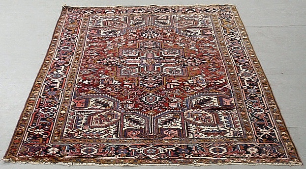 Appraisal: - Room size Heriz oriental carpet with a red field