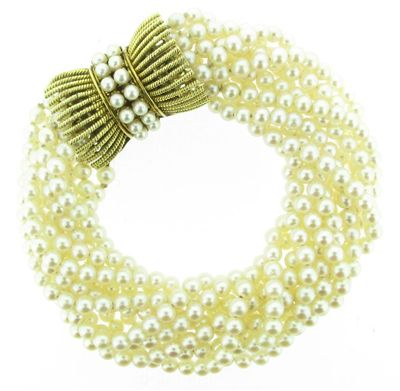 Appraisal: A multistrand cultured pearl bracelet The gold clasp set with