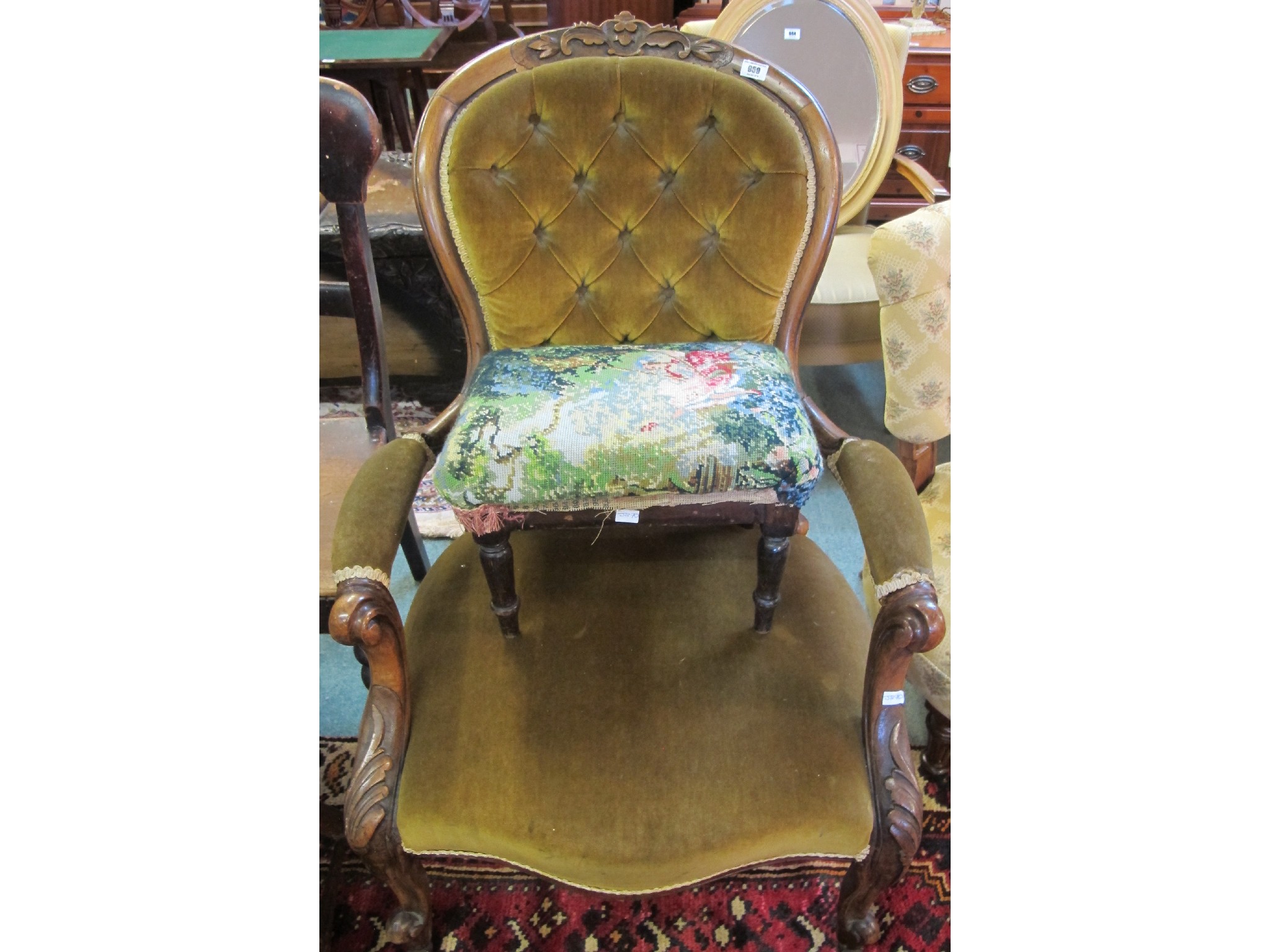 Appraisal: A Victorian upholstered armchair and stool