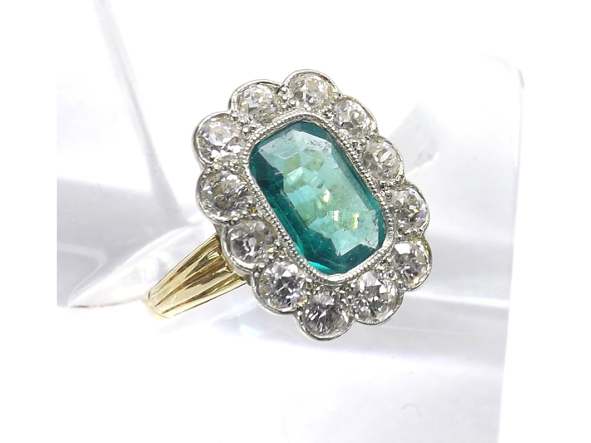 Appraisal: Emerald and diamond cluster ring the central emerald in a