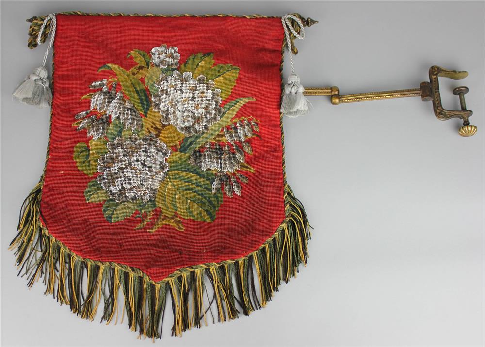 Appraisal: ENGLISH BANNER FIRESCREEN AND BRASS HANGING CLAMP the fringed needlework