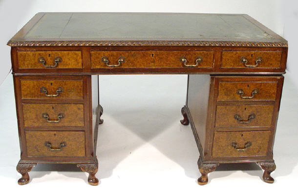 Appraisal: s walnut twin pedestal desk the top with gadrooned edge