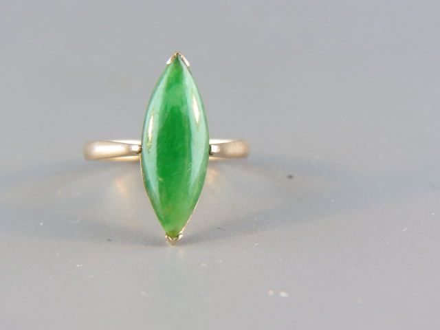 Appraisal: Jade Ring deep spinach green marquise stone in k rose