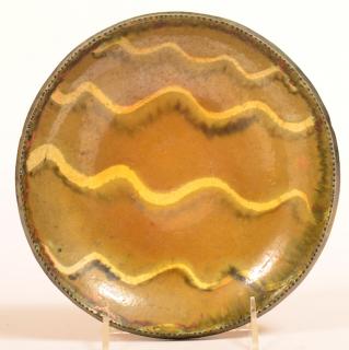 Appraisal: Stahl Redware Slip Decorated Plate Stahl Redware Pottery Yellow and