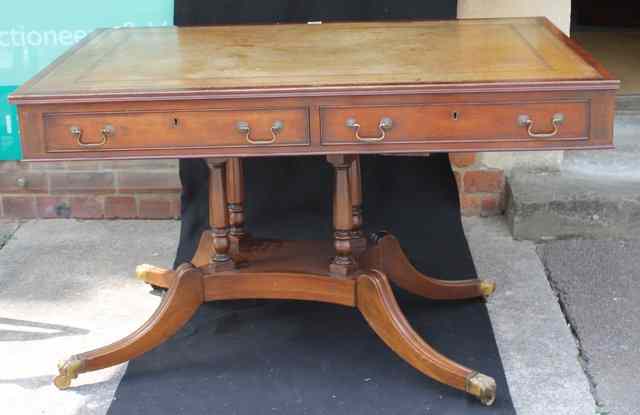 Appraisal: A GEORGIAN STYLE MAHOGANY DESK with inset leather panel a