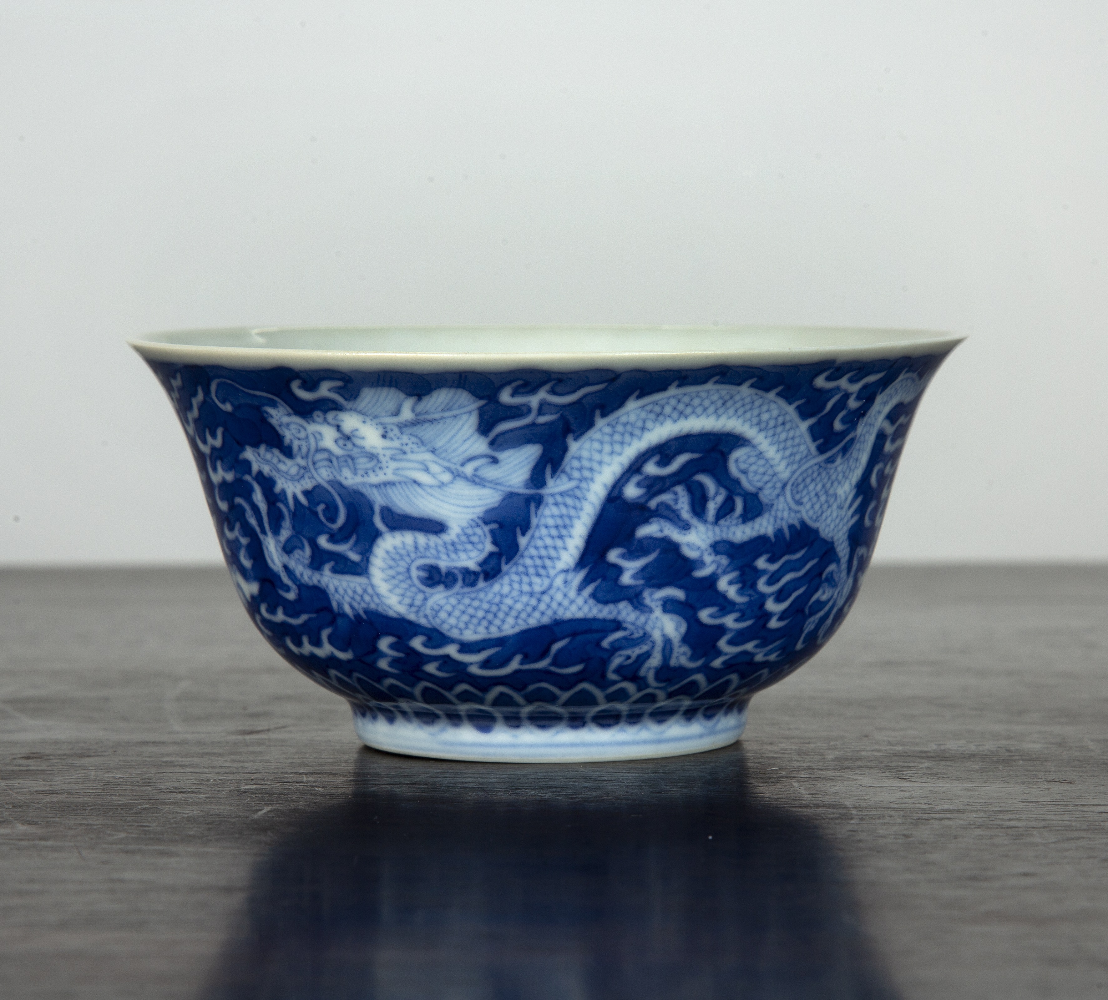 Appraisal: Blue and white 'dragon' bowl or cupChinese decorated to the