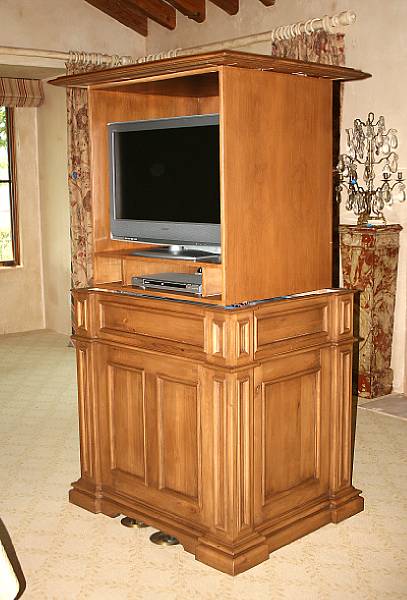 Appraisal: A Neoclassical style walnut mechanical television cabinet height in width