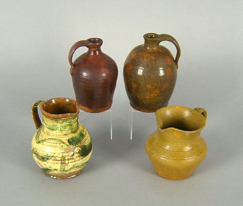 Appraisal: Two redware jugs together with two pitchers tallest is