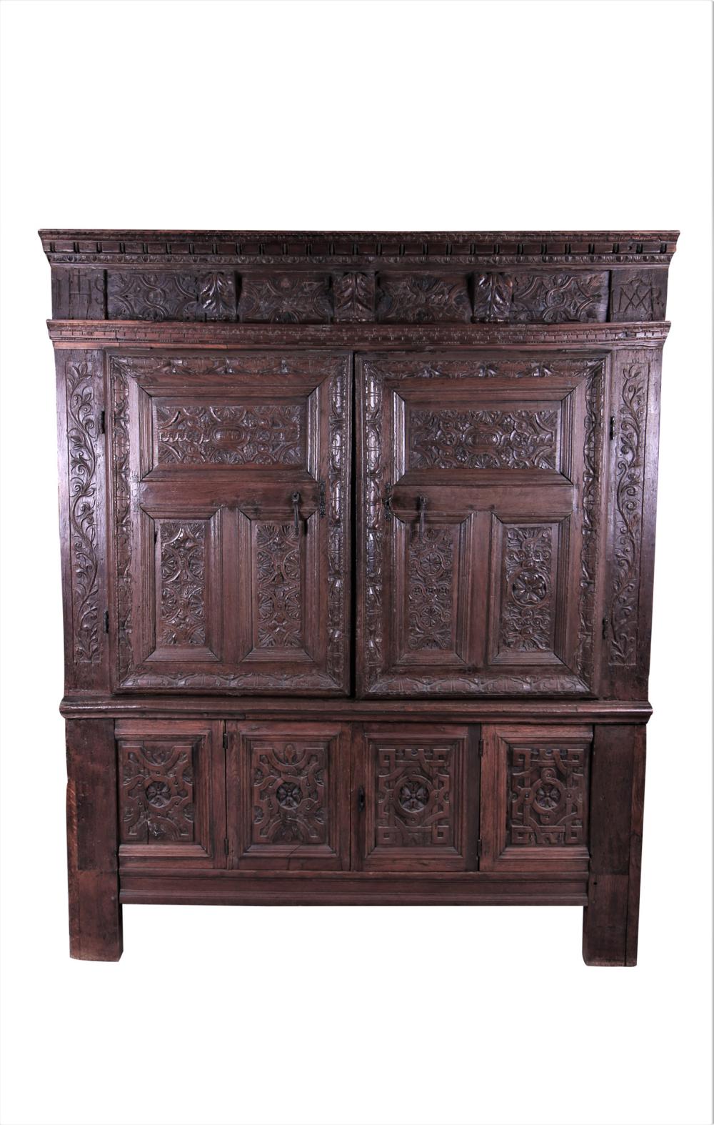 Appraisal: BRITTANY CARVED WALNUT ARMOIREthe two exterior doors resting on two