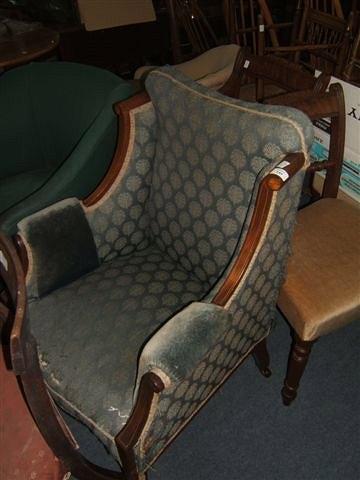 Appraisal: A Victorian mahogany and satinwood upholstered armchair with square tapering