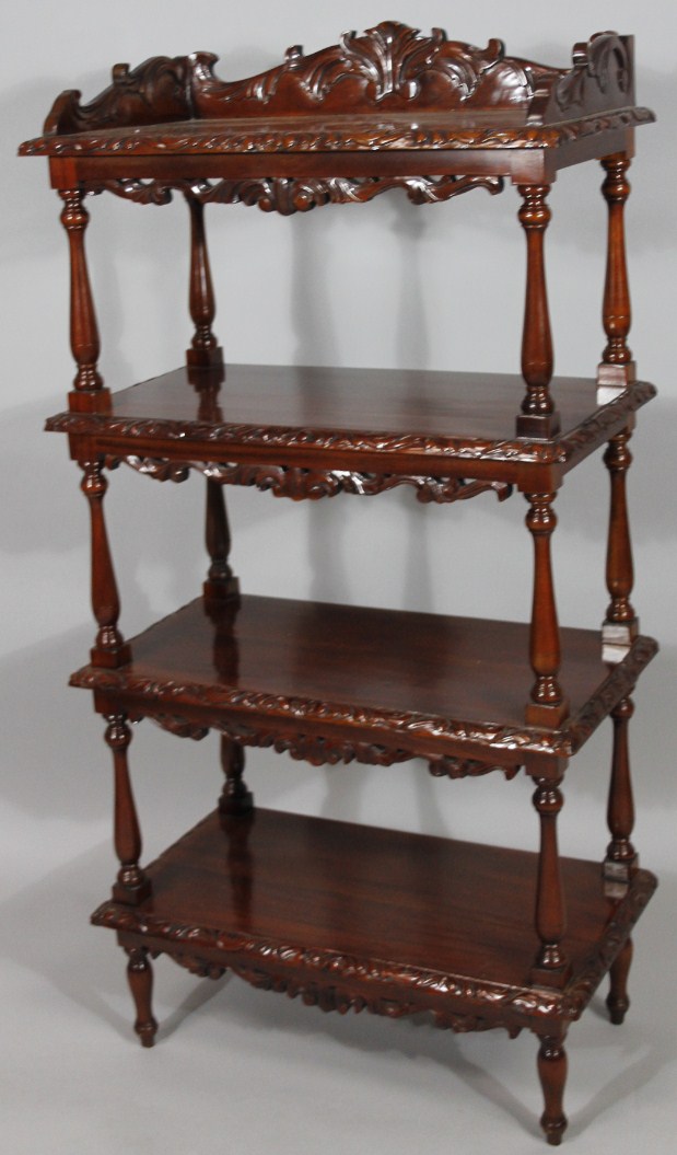 Appraisal: A reproduction Victorian mahogany four tier carved mahogany whatnot