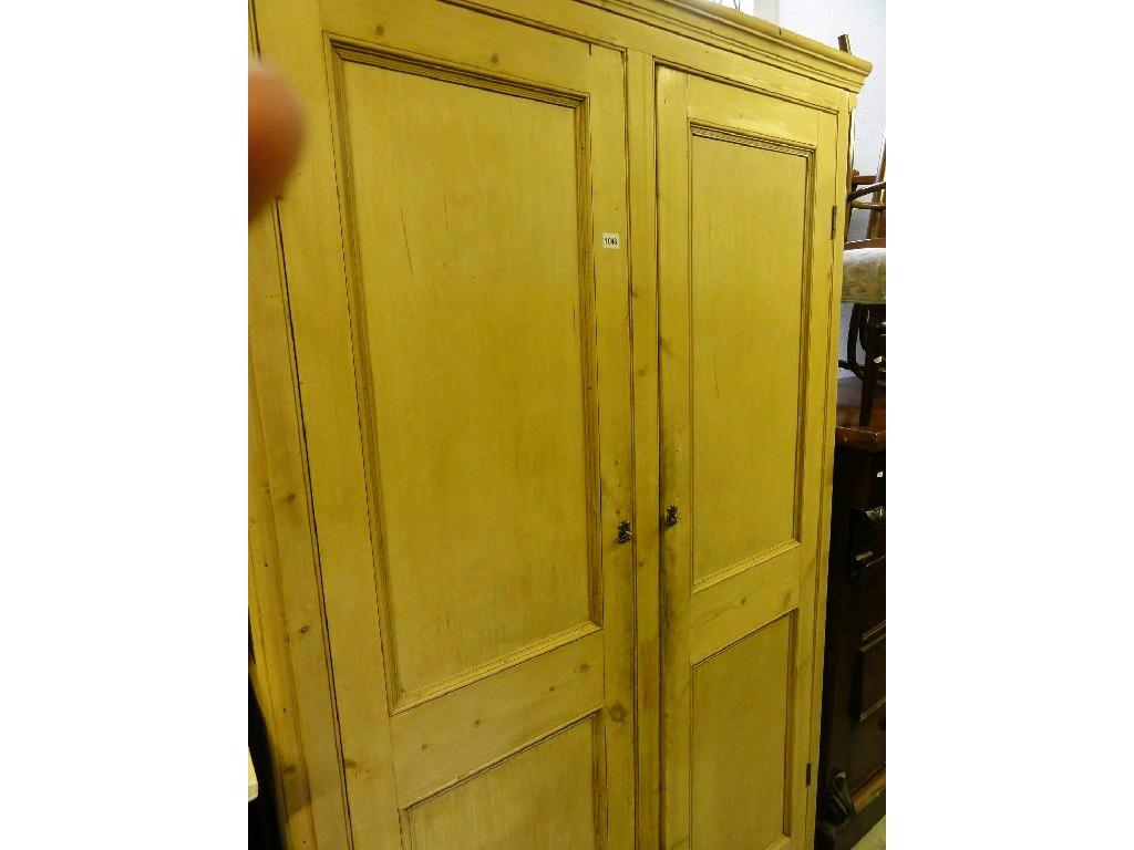 Appraisal: A Victorian stripped pine side cupboard enclosed by a pair