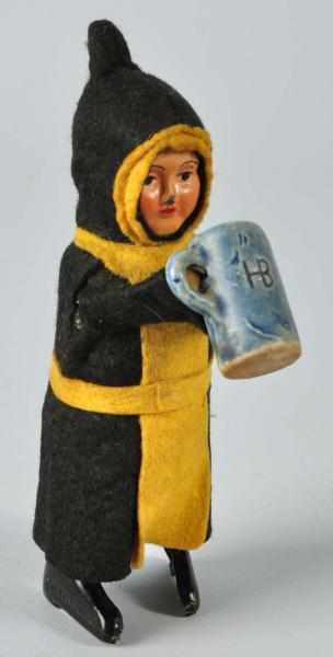 Appraisal: Schuco Munich Maiden Figural Wind-Up Toy Description German Working Marked