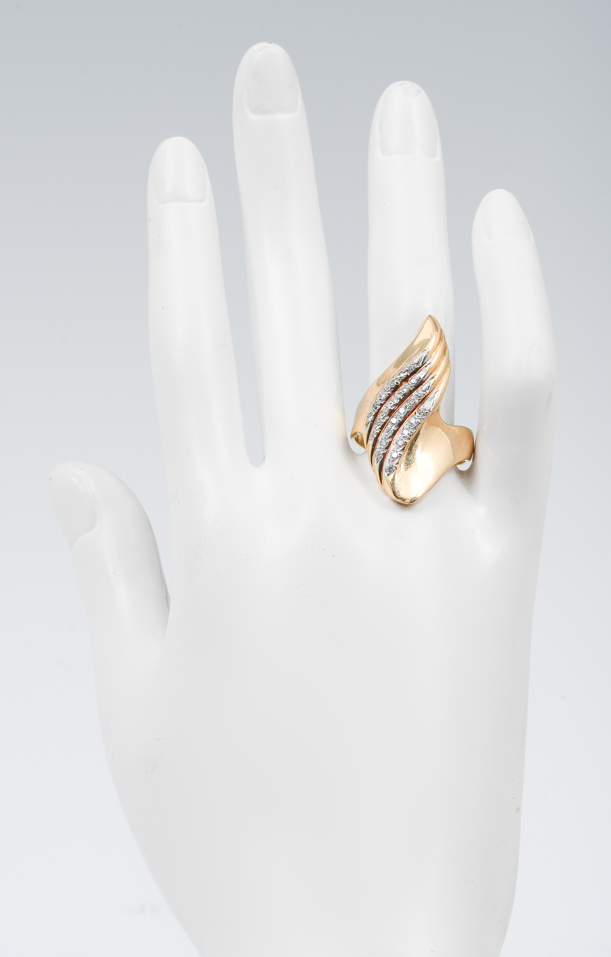 Appraisal: VINTAGE K DIAMOND WAVE RING K yellow gold ring contains