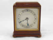 Appraisal: A square mahogany mantel clock on pad feet in the