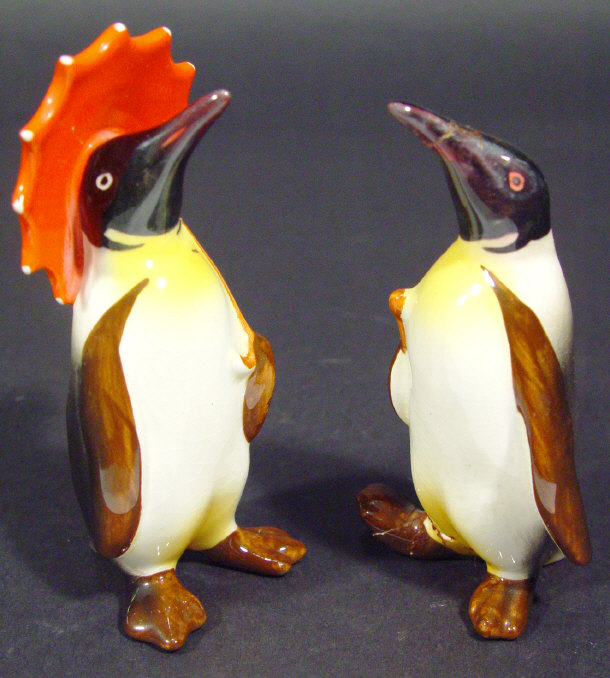 Appraisal: Two Beswick penguins one clutching a red umbrella both with