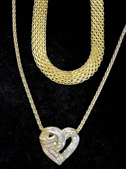 Appraisal: Two karat yellow gold necklacesOne of woven yellow gold the