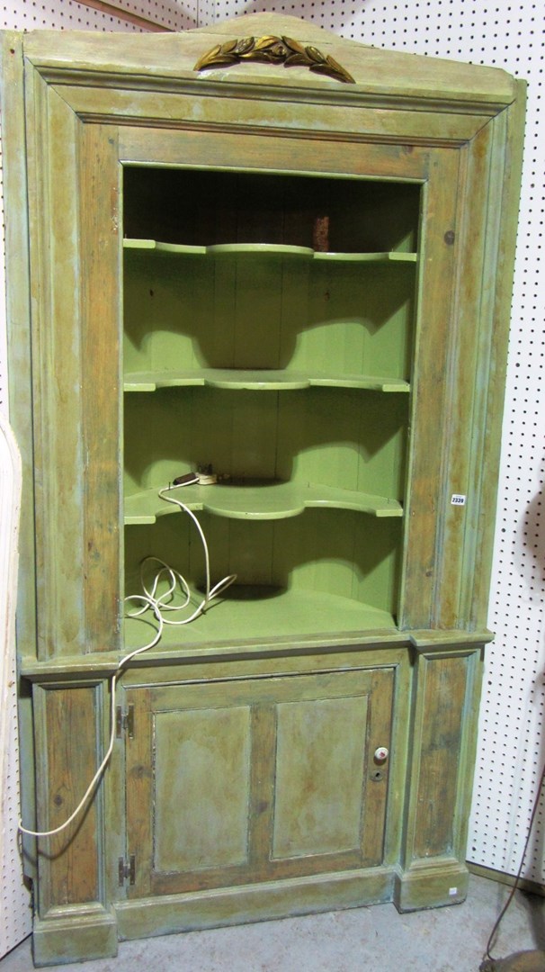 Appraisal: A large th century green painted barrel back corner cupboard