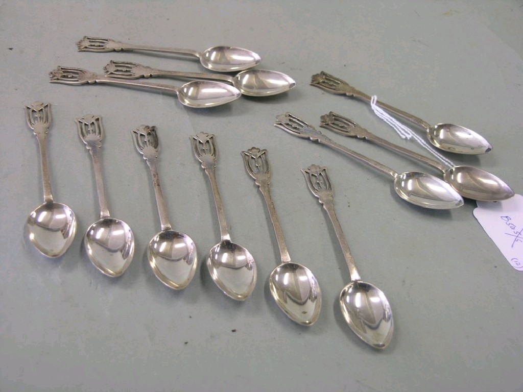 Appraisal: A set of twelve silver coffee spoons with stylised ends