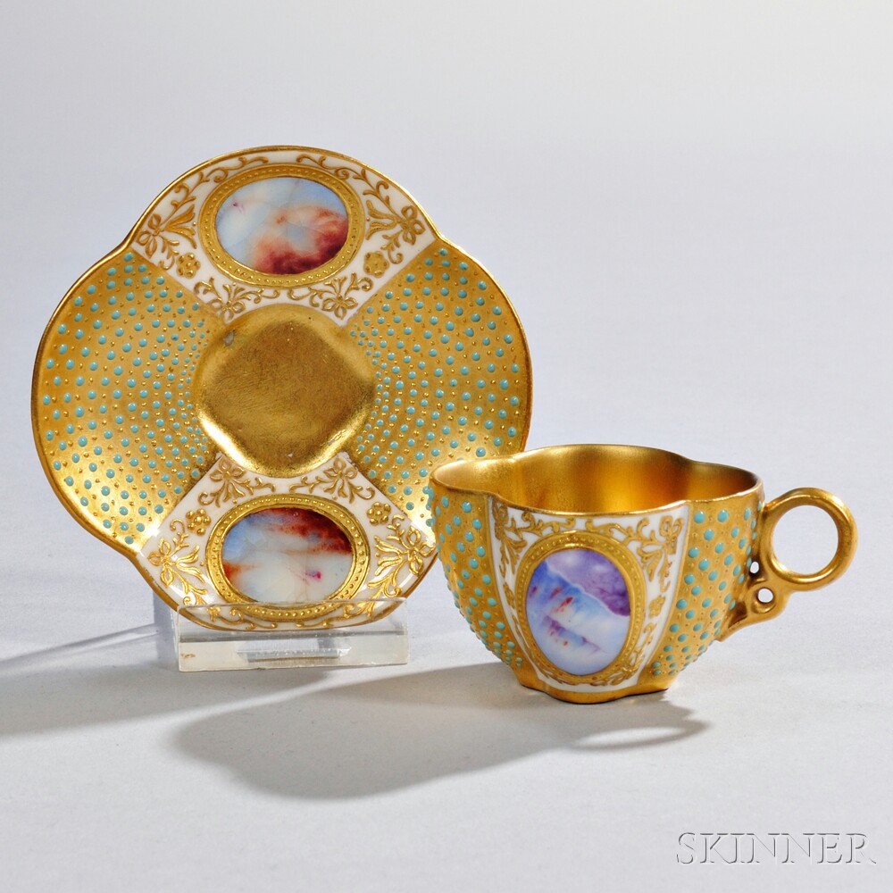 Appraisal: Jeweled Coalport Porcelain Quatrefoil-shaped Cup and Saucer England late th